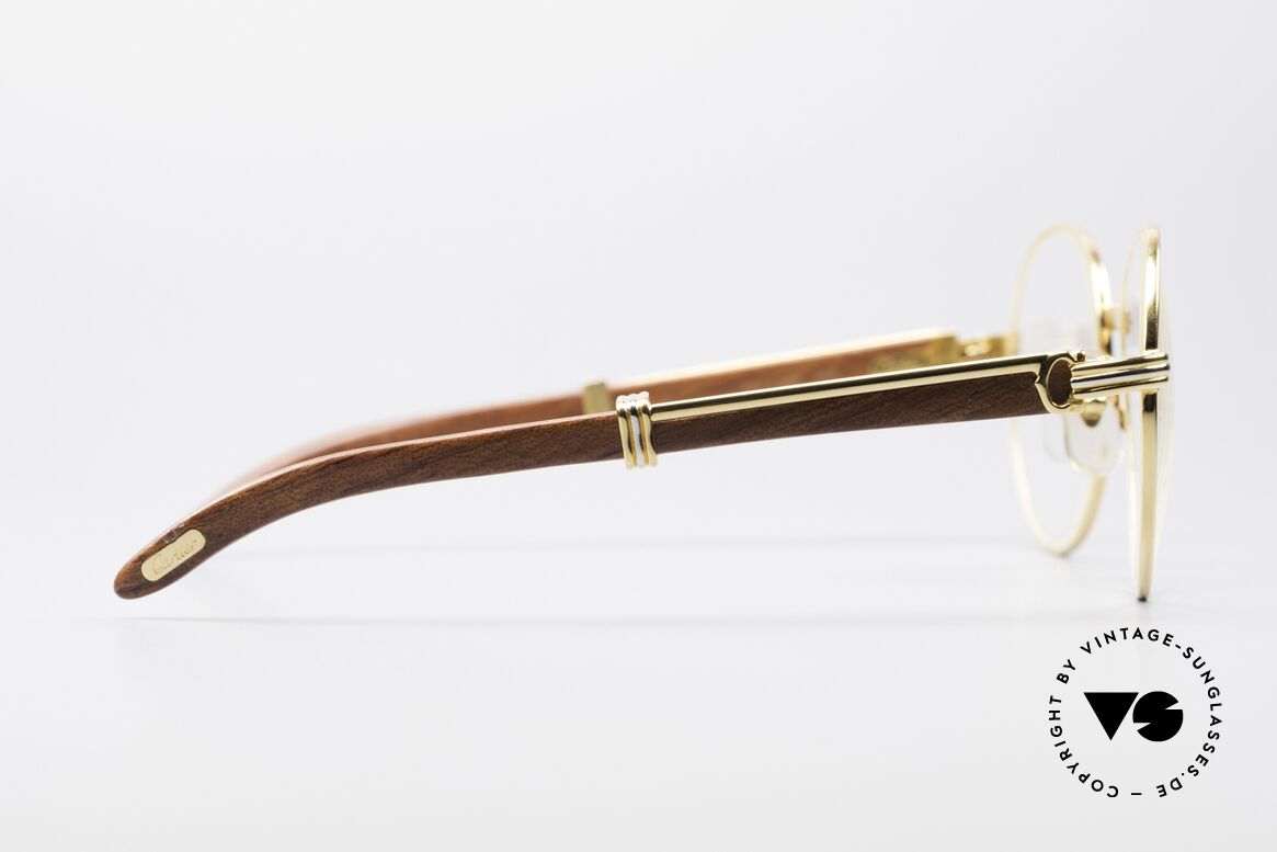 Cartier Bagatelle Bubinga Edelholzbrille Luxus, runde, vergoldete Fassung mit Federscharnieren, Passend für Herren und Damen