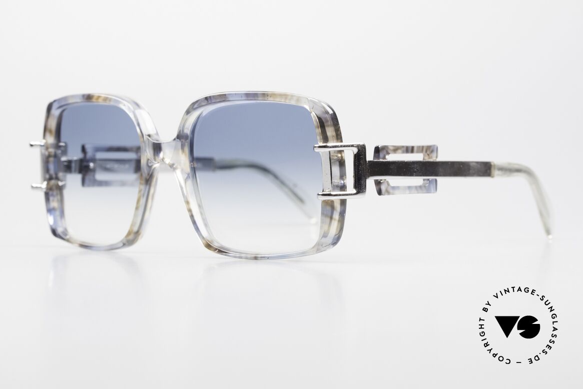 Neostyle Stereo 5 70er Sonnenbrille Old School, bläulich-transparent gemustert und silberne Bügel, Passend für Damen