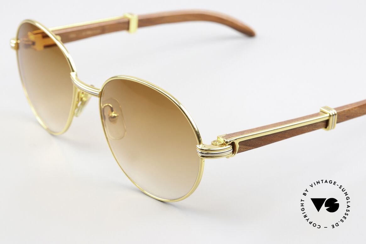 Cartier Bagatelle Bubinga Edelholzbrille Luxus, runde, vergoldete Fassung mit Federscharnieren, Passend für Herren und Damen Cartier Bagatelle Bubinga Edelholzbrille Luxus, runde, vergoldete Fassung mit Federscharnieren, Passend für Herren und Damen