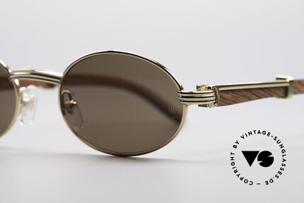 Cartier Sully Ovale Edelholz Sonnenbrille, ovale, vergoldete Fassung mit Feder-Scharnieren, Passend für Herren und Damen