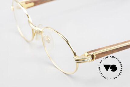 Cartier Giverny Ovale Holzbrille Vergoldet, ovale, vergoldete Fassung mit Feder-Scharnieren, Passend für Herren und Damen