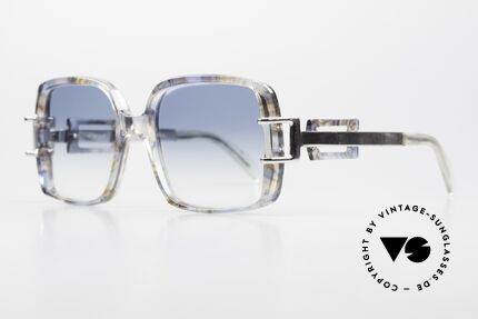 Neostyle Stereo 5 70er Sonnenbrille Old School, bläulich-transparent gemustert und silberne Bügel, Passend für Damen