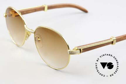 Cartier Bagatelle Bubinga Edelholzbrille Luxus, runde, vergoldete Fassung mit Federscharnieren, Passend für Herren und Damen Cartier Bagatelle Bubinga Edelholzbrille Luxus, runde, vergoldete Fassung mit Federscharnieren, Passend für Herren und Damen